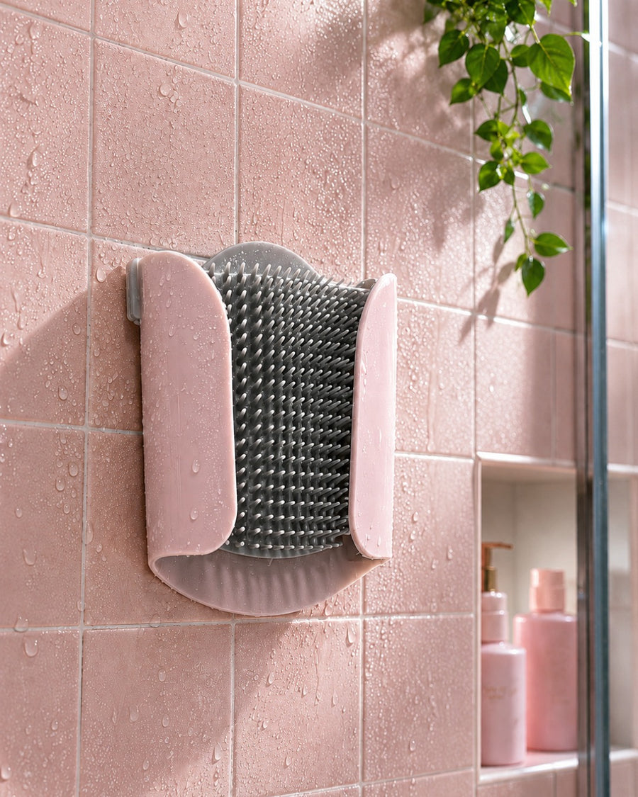 Silicone shower hair catcher mounted on bathroom wall